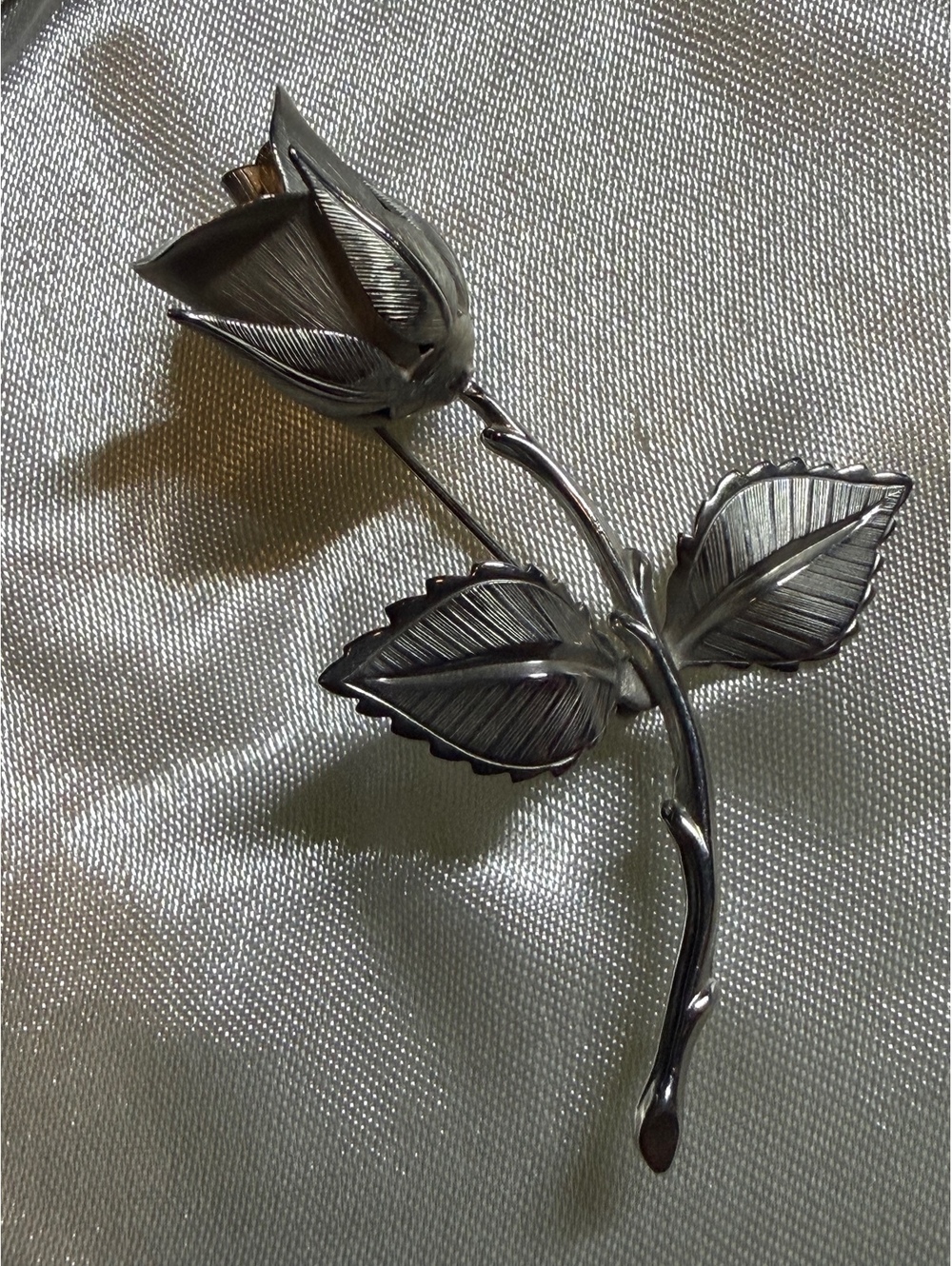 Silver tone rose brooch